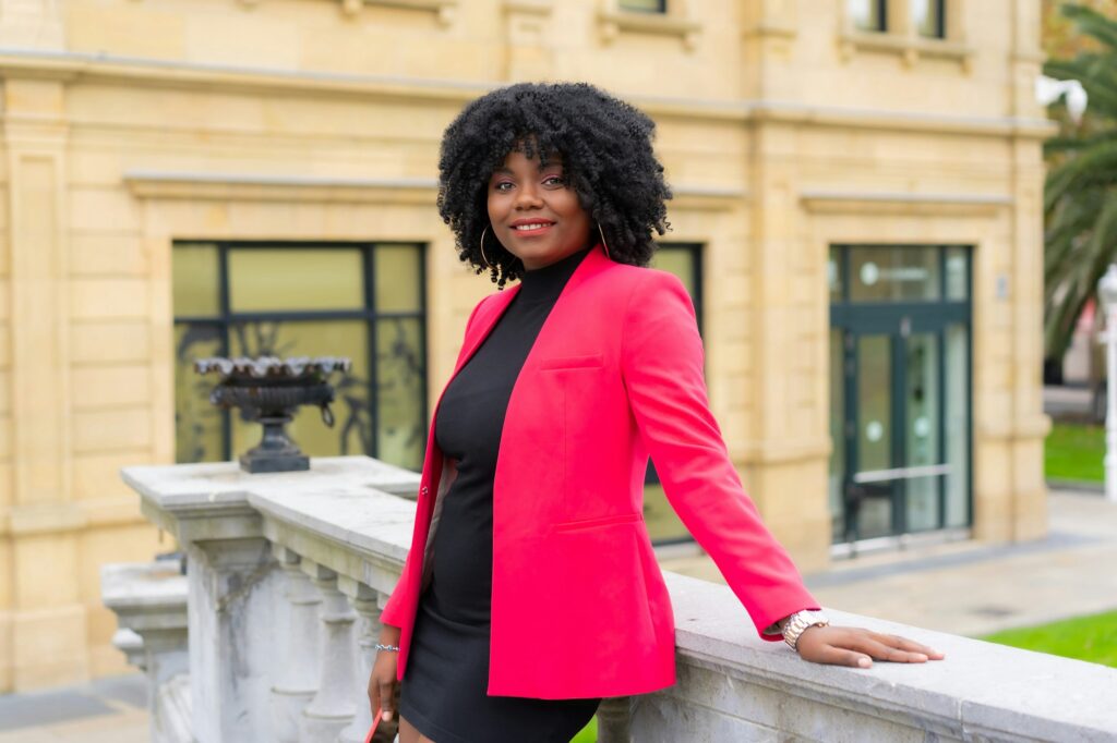 African businesswoman posing in a public park